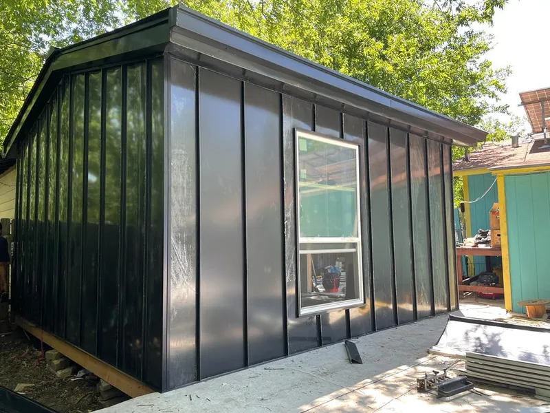 Black standing seam metal wall panels for Roof Inspection in Hayden