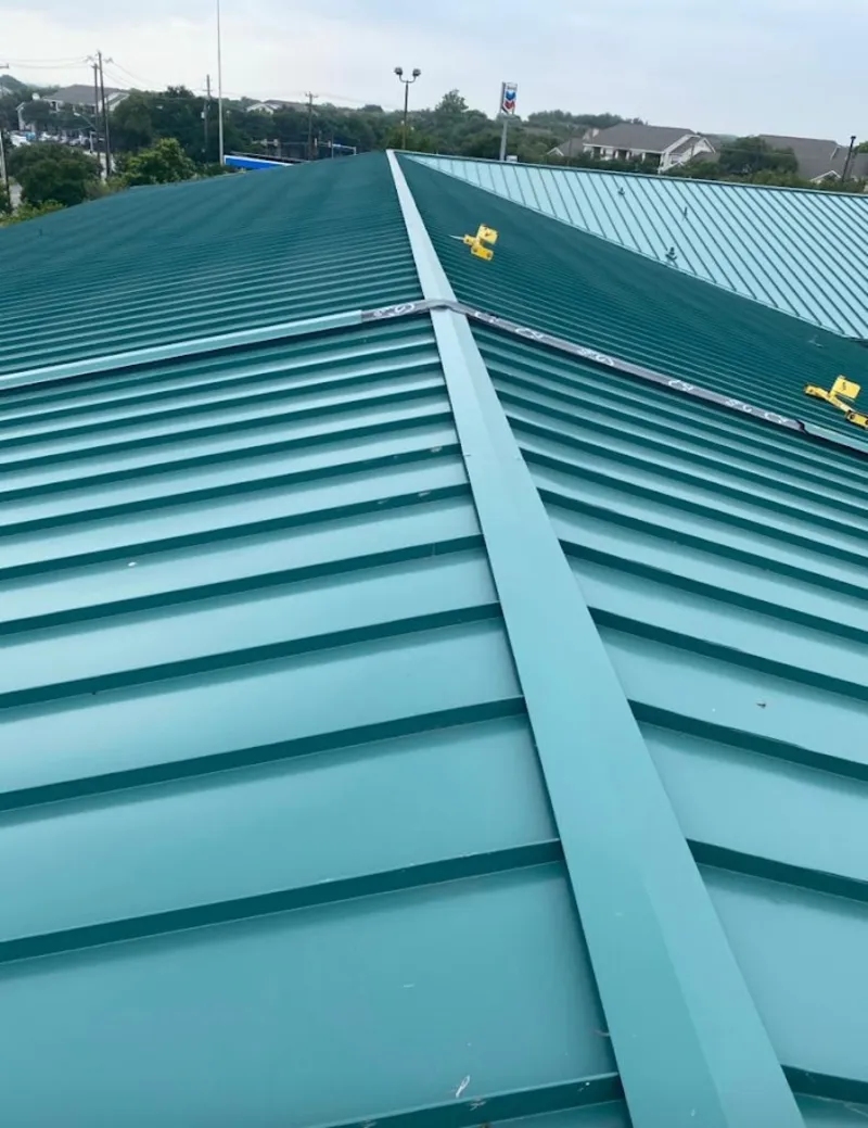 Green commercial metal roof ridge and valley for Metal Roof Repair in Hayden
